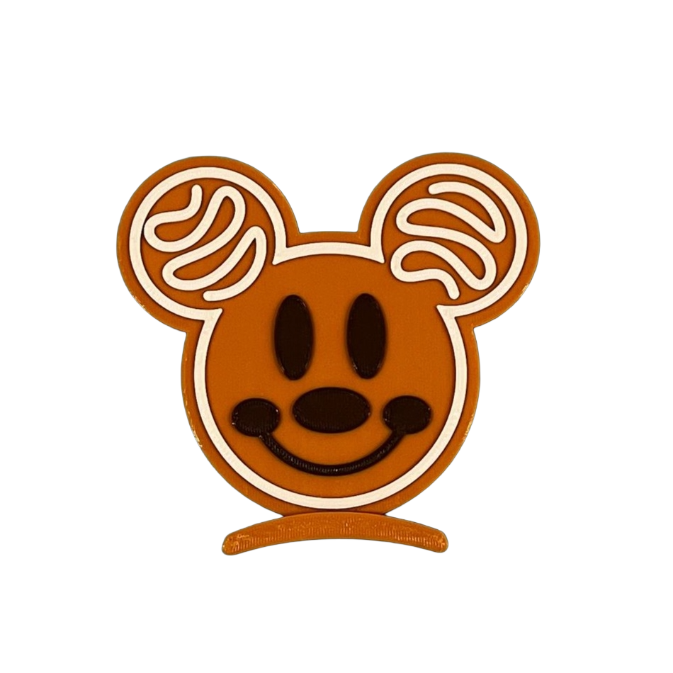 Mickey Mouse head icon with brown face and ears on a white background