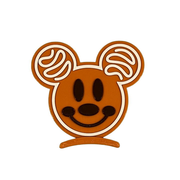 Mickey Mouse head icon with brown face and ears on a white background